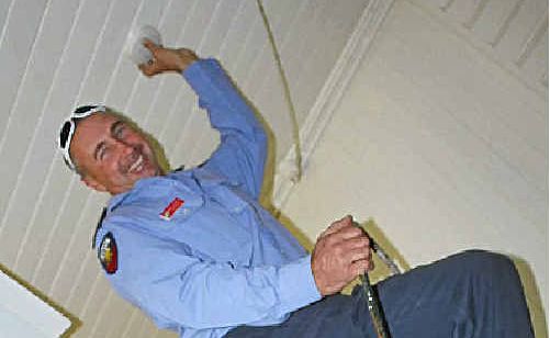 Warwick resident Jill Fraser has her fire alarm installed by Warwick firefighter Shane Cartwright. Warwick resident Jill Fraser has her fire alarm installed by Warwick firefighter Shane Cartwright.